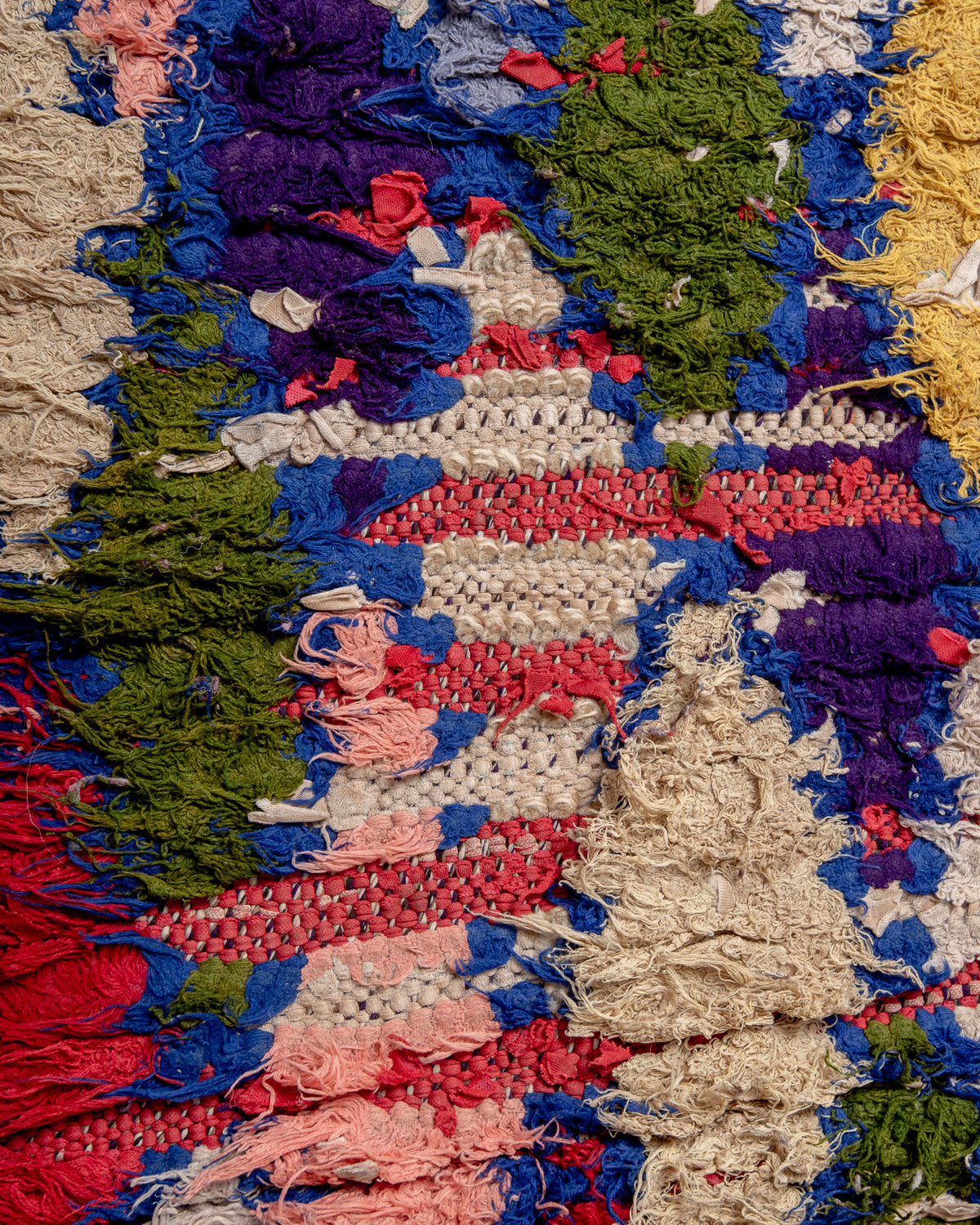 Modern designer vintage handcrafted Berber rug from Morocco. Boucherouite with beautiful colors and patterns.